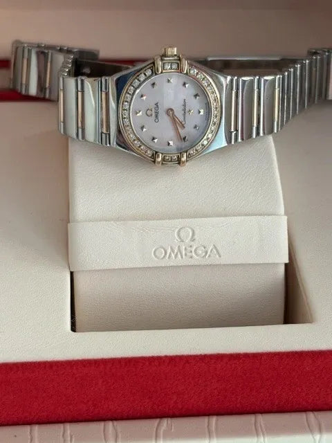 Montre femme Omega Constellation or 18 carats et lunette diamant acier série complète 2003