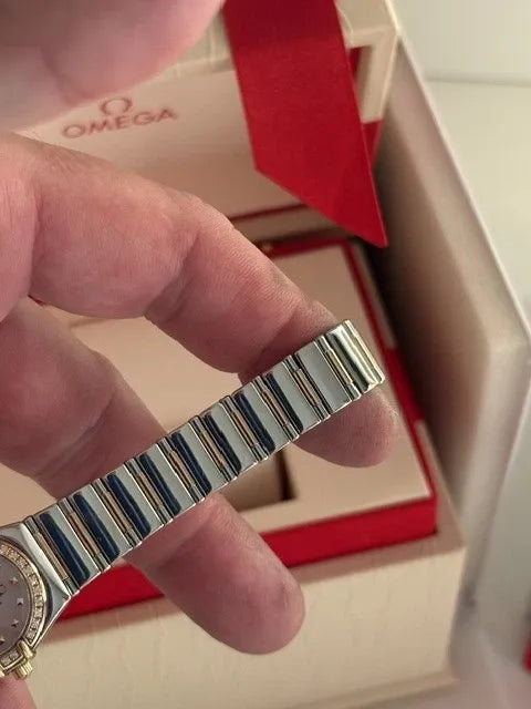 Montre femme Omega Constellation or 18 carats et lunette diamant acier série complète 2003