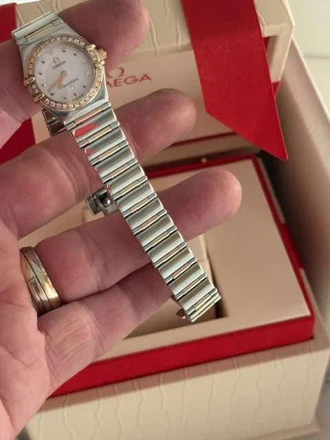Montre femme Omega Constellation or 18 carats et lunette diamant acier série complète 2003