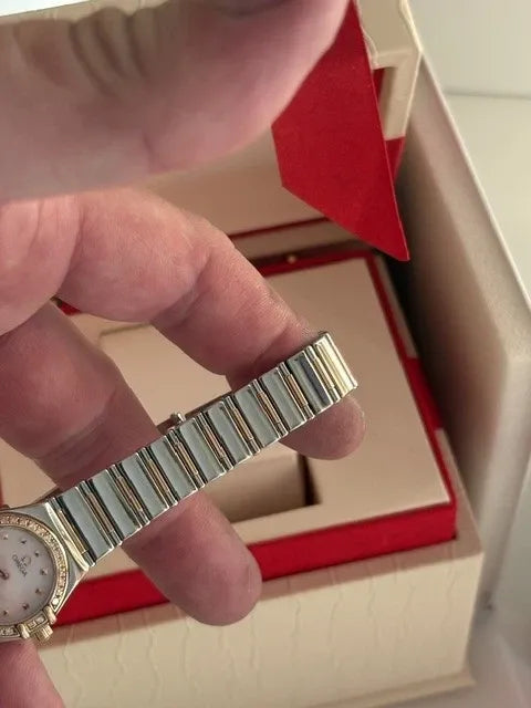 Montre femme Omega Constellation or 18 carats et lunette diamant acier série complète 2003