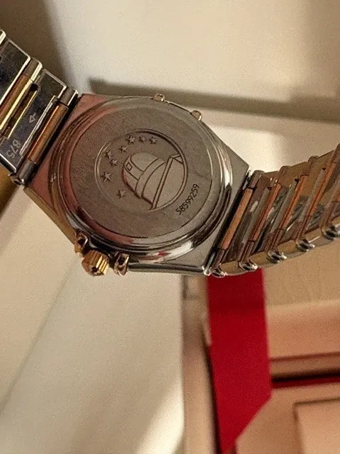 Montre femme Omega Constellation or 18 carats et lunette diamant acier série complète 2003